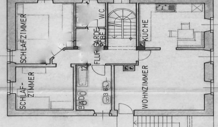 Een plattegrond van een appartement met meerdere kamers. De ruimtes omvatten een woonkamer, slaapkamer, keuken en badkamer.
