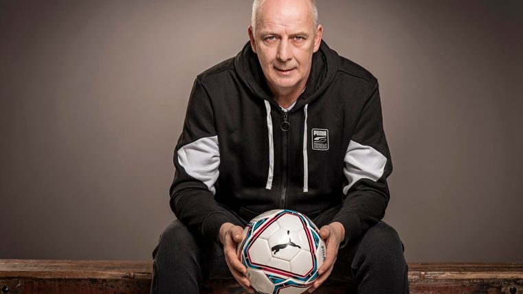 Sitting man with a ball in his hand