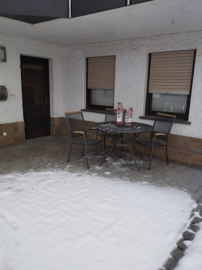 Outdoor area with a table and chairs