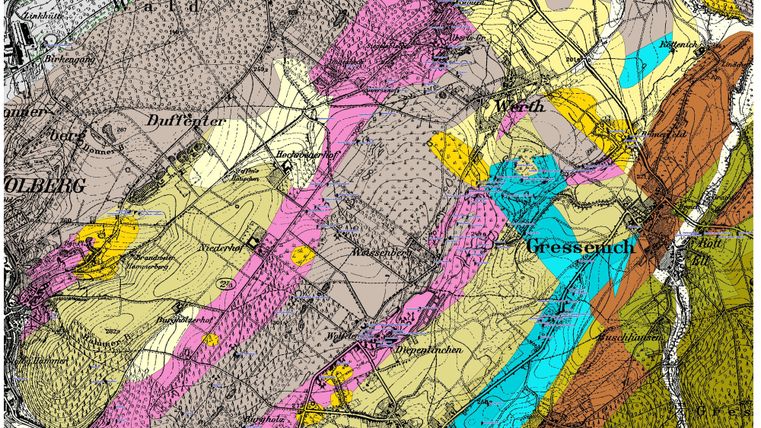 Een historische geologische kaart met verschillende kleuren die verschillende gesteente types voorstellen. De kaart toont ook geografische namen en lijnen die het terrein markeren.