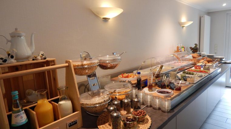 A rich breakfast buffet with various foods and beverages. The presentation is appealing and inviting.