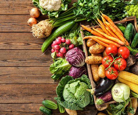 A selection of vegetables is spread out on a table.
