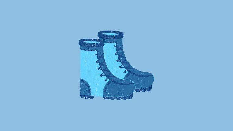 A pair of blue rubber boots on a light background. They have a classic shape with lacing.