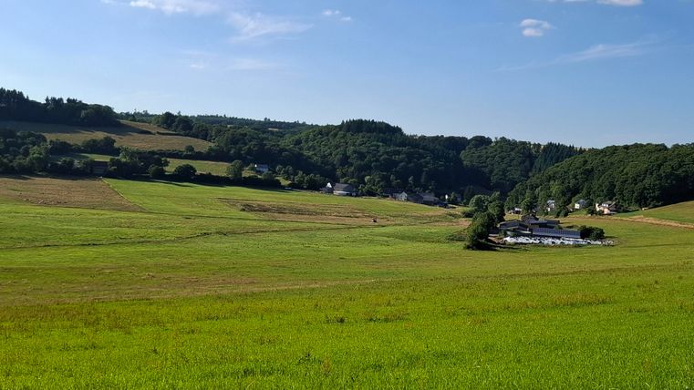 he view from the forest into the village shows the beautiful connection to nature