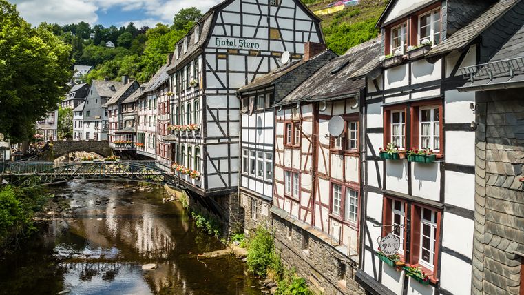 Half-timbered houses along a river in Monschau.