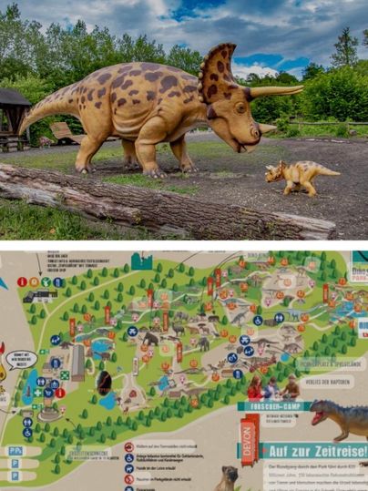 A dinosaur model stands next to a small dinosaur. In the background, a map of a theme park can be seen.