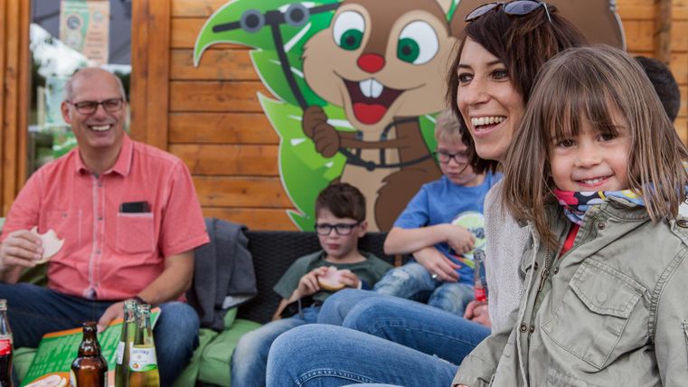 laughing family with drinks