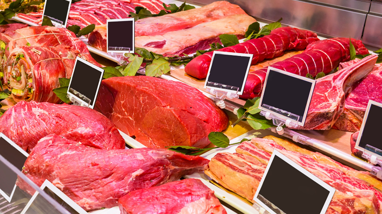 Fresh counter in the butcher's shop. A large selection of meat is visible.