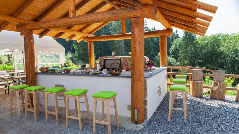 Barbecue area under wooden roof