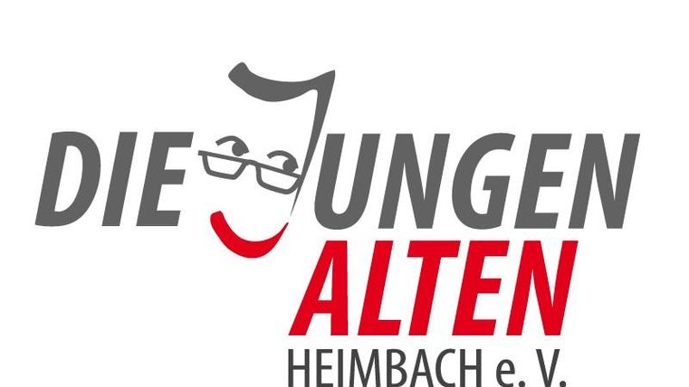 Een logo van de groep "Die Jungen Alten" uit Heimbach e.V. met een gestileerde gezichtspresentatie. De kleuren rood en grijs domineren, met een vriendelijke uitstraling.