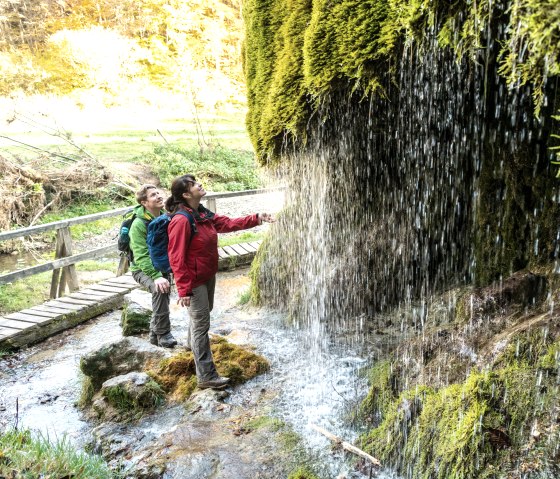 Refreshment at the Dreimühlen waterfall on the Eifelsteig trail, © Eifel Tourismus GmbH, D. Ketz